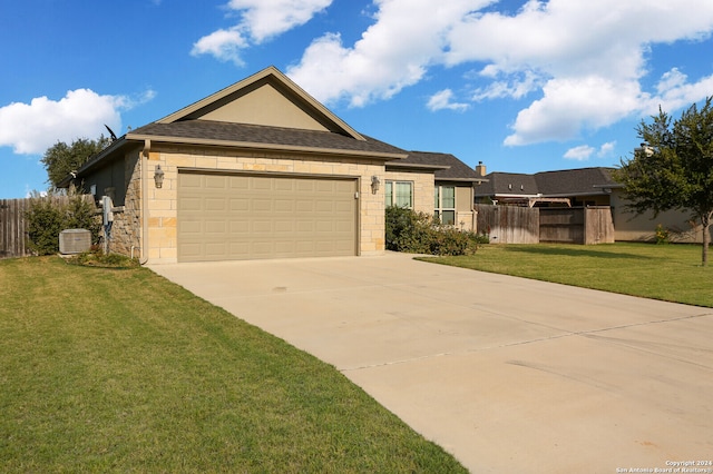 ranch-style house featuring a front yard and a garage