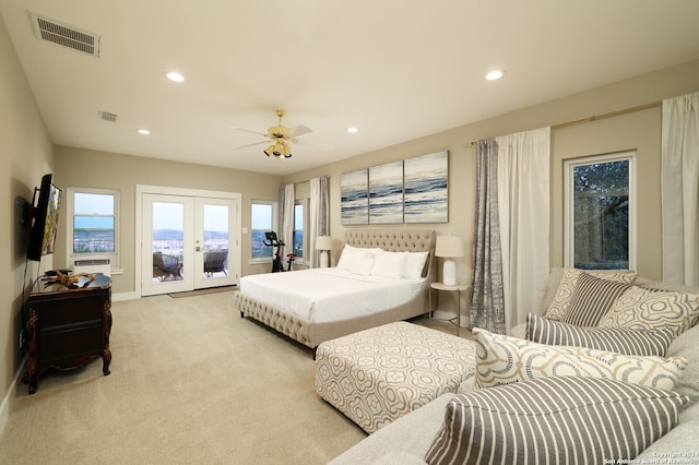 carpeted bedroom with ceiling fan, french doors, and access to exterior