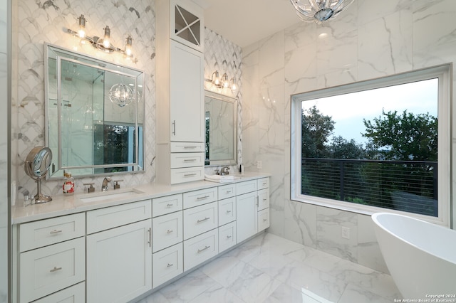 bathroom featuring plus walk in shower, vanity, tile patterned flooring, and tile walls