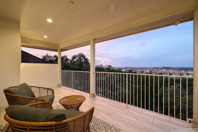 view of balcony at dusk