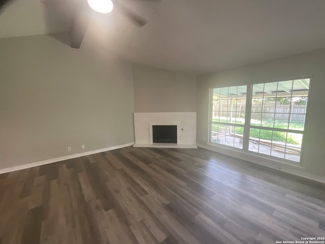 unfurnished living room with dark hardwood / wood-style floors