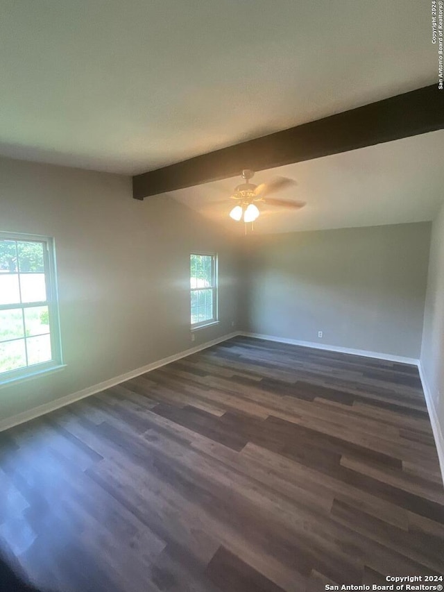 unfurnished room featuring vaulted ceiling with beams, dark hardwood / wood-style floors, and ceiling fan