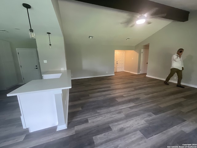 unfurnished living room with dark hardwood / wood-style flooring and lofted ceiling with beams