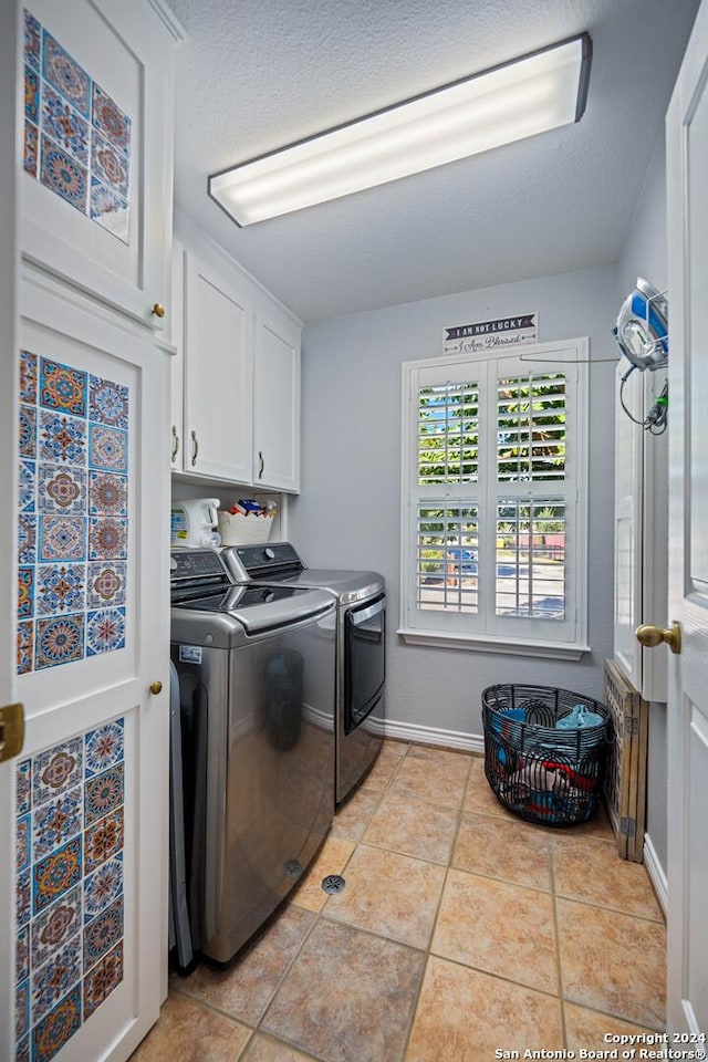 735 Hot Shot Ln, Mcqueeney, TX 78123 - washroom with light tile patterned floors, separate washer and dryer, cabinet space, and baseboards