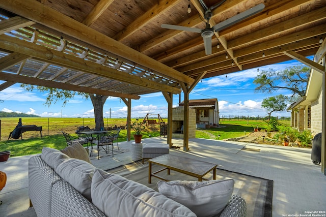 view of patio / terrace with an outdoor hangout area, a pergola, and an outbuilding