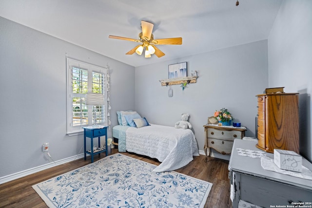 735 Hot Shot Ln, Mcqueeney, TX 78123 - bedroom with ceiling fan, dark wood finished floors, and baseboards
