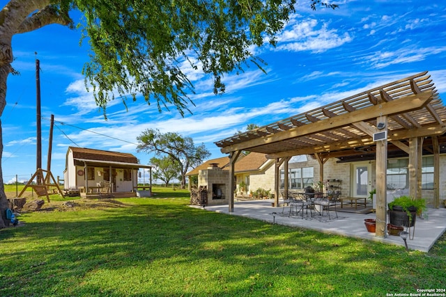 735 Hot Shot Ln, Mcqueeney, TX 78123 - view of yard featuring an outdoor fireplace, a pergola, and a patio area