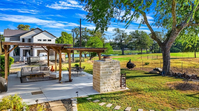 735 Hot Shot Ln, Mcqueeney, TX 78123 - view of property's community featuring an outdoor hangout area, a fenced backyard, a yard, and a patio area
