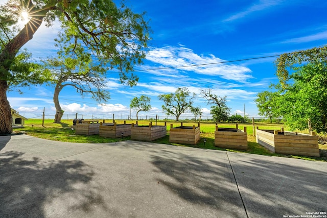 735 Hot Shot Ln, Mcqueeney, TX 78123 - surrounding community featuring a vegetable garden and a lawn