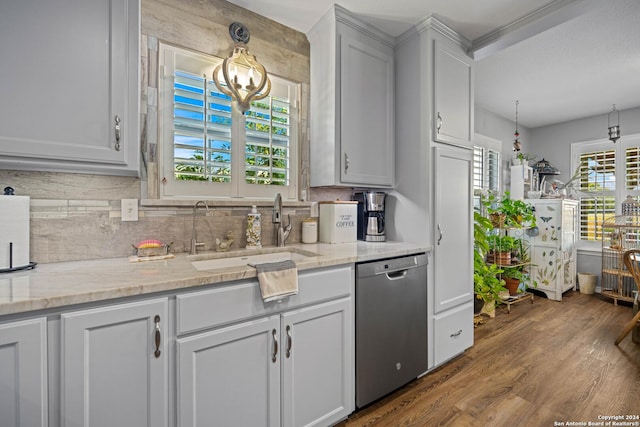 735 Hot Shot Ln, Mcqueeney, TX 78123 - kitchen featuring tasteful backsplash, stainless steel dishwasher, light stone counters, a sink, and dark wood-style floors