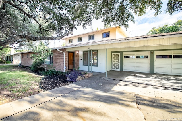 view of front of property featuring covered porch and a garage