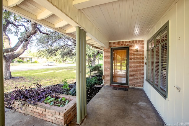 doorway to property with a yard