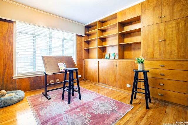 office area featuring crown molding and light wood-type flooring