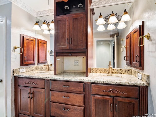 bathroom featuring vanity and crown molding