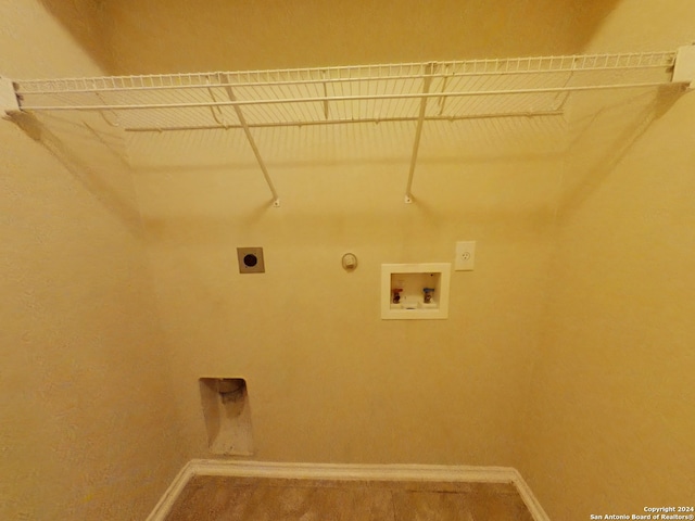 laundry area featuring carpet flooring, electric dryer hookup, hookup for a gas dryer, and hookup for a washing machine