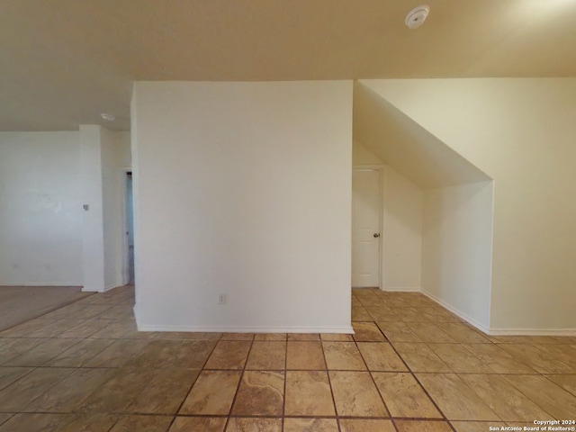 additional living space with light tile patterned flooring