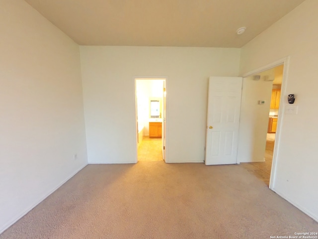 unfurnished bedroom with light carpet