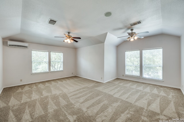 spare room featuring lofted ceiling, ceiling fan, and plenty of natural light