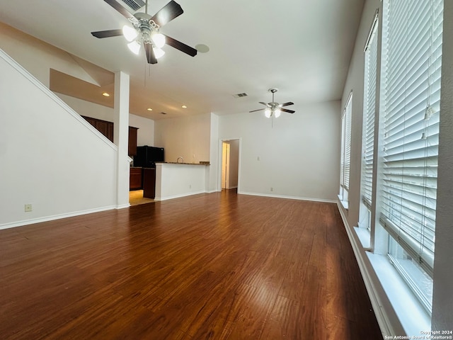 unfurnished room featuring hardwood / wood-style floors and ceiling fan