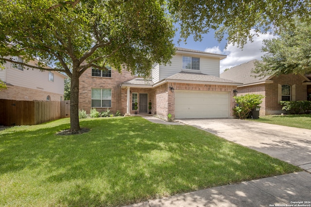 front of property featuring a front yard and a garage