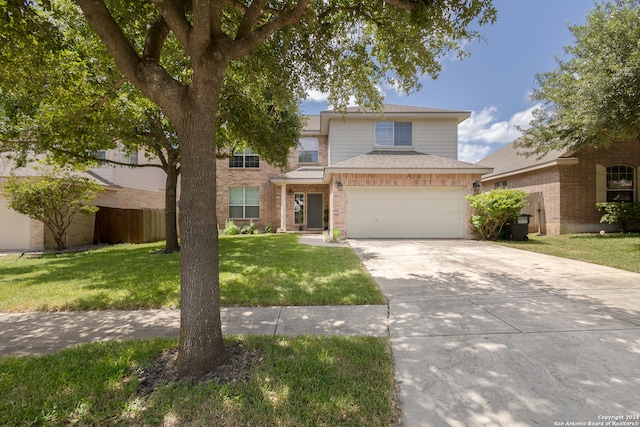 front facade with a garage and a front lawn