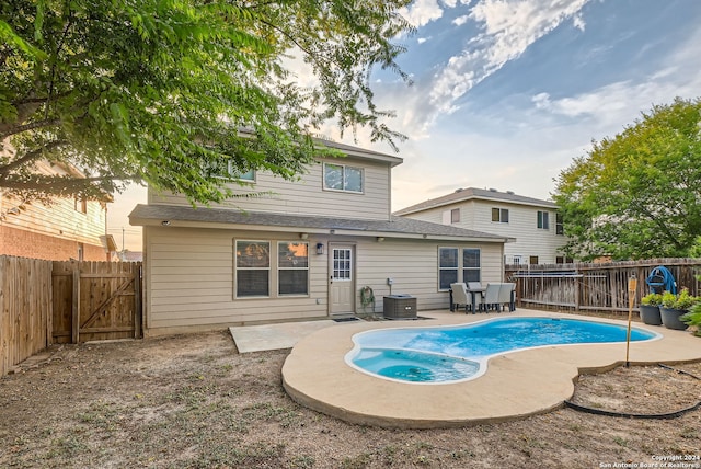 view of swimming pool featuring a patio and central AC