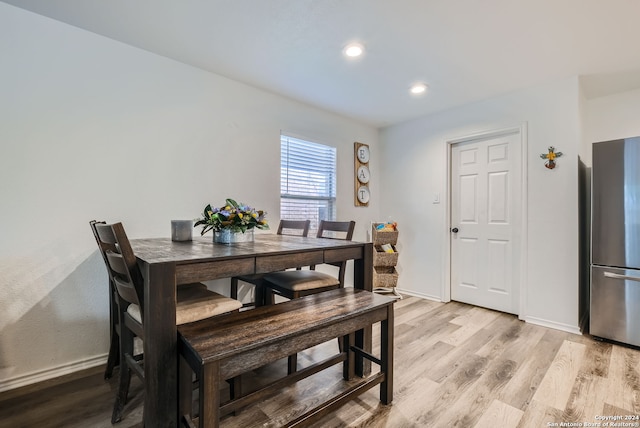 dining space with light wood-type flooring