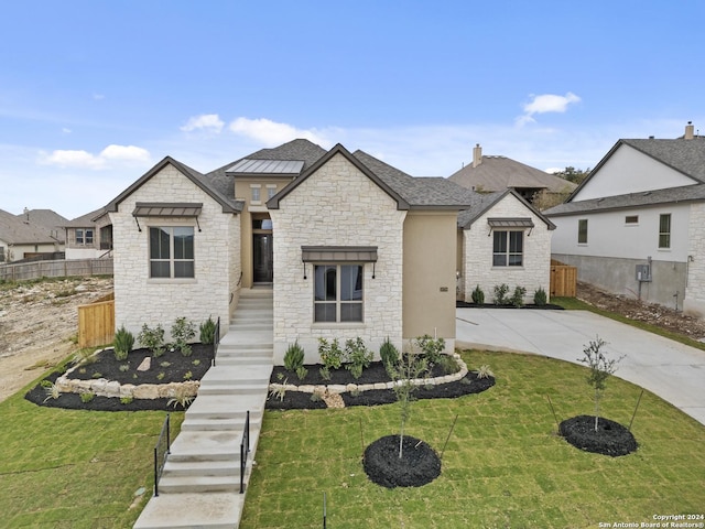 view of front of property with fence and a front yard