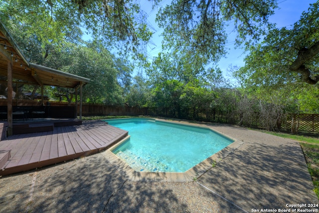 view of pool featuring a wooden deck