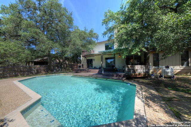 view of swimming pool with a patio