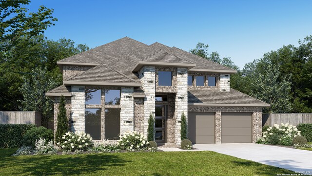 view of front facade featuring a garage and a front yard