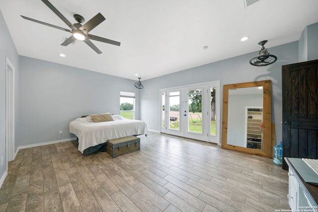 bedroom with light wood-style floors, access to outside, baseboards, and recessed lighting