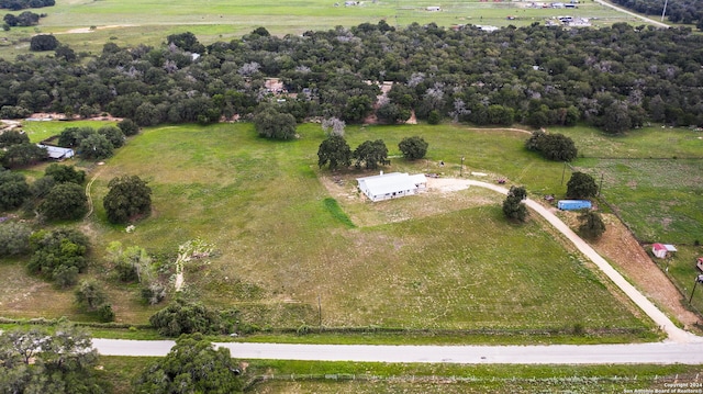 birds eye view of property featuring a rural view