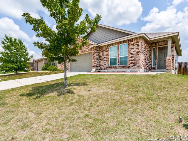 single story home featuring a garage and a front yard