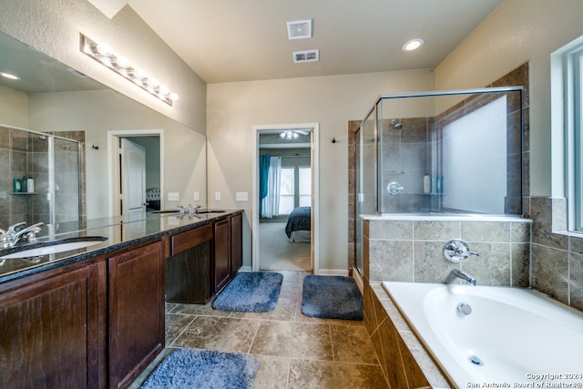 bathroom with plus walk in shower, tile patterned flooring, and vanity