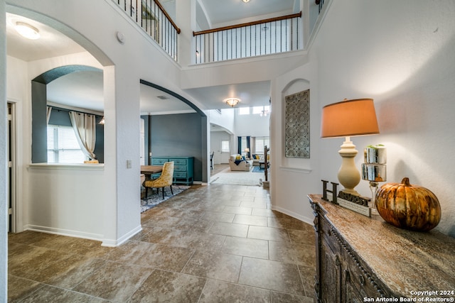 foyer entrance featuring a high ceiling and tile patterned floors