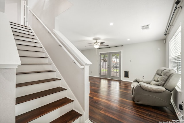 staircase featuring ceiling fan, french doors, and hardwood / wood-style floors