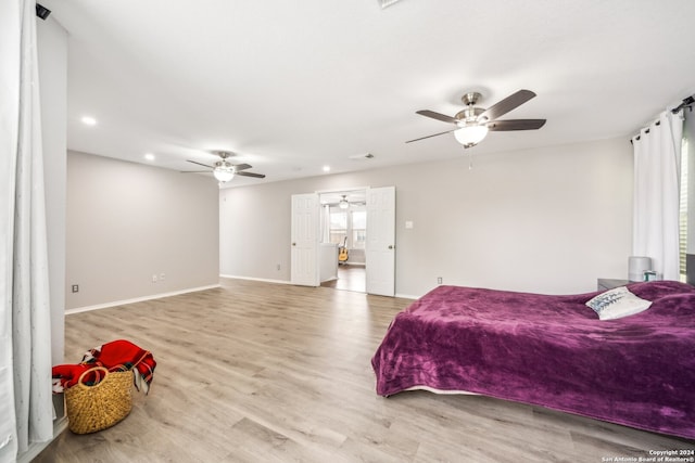 bedroom featuring ceiling fan and light hardwood / wood-style floors