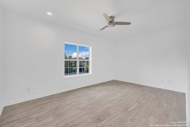 unfurnished room featuring recessed lighting, ceiling fan, baseboards, and wood finished floors