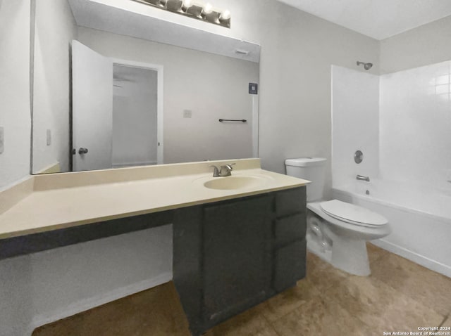 full bathroom with tile patterned floors, toilet,  shower combination, and vanity