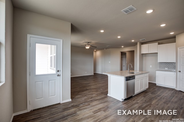 kitchen with white cabinets, a sink, a center island with sink, and dishwasher