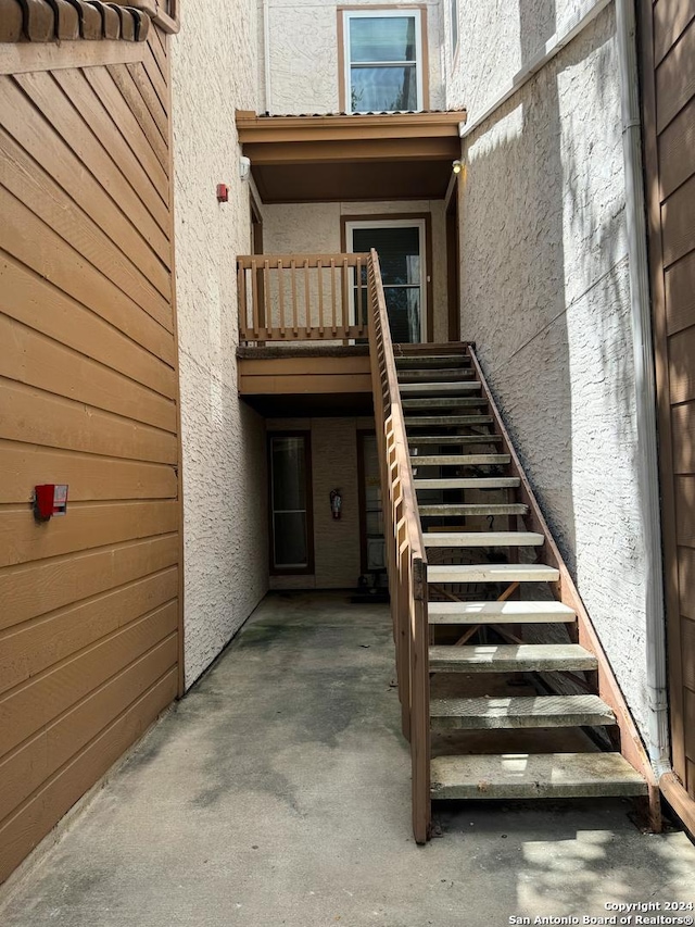 exterior space featuring a patio and stucco siding