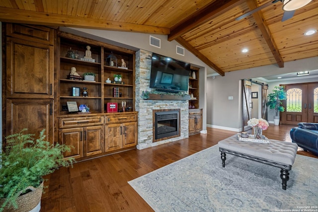 living room featuring a fireplace, lofted ceiling with beams, dark wood-type flooring, visible vents, and wood ceiling