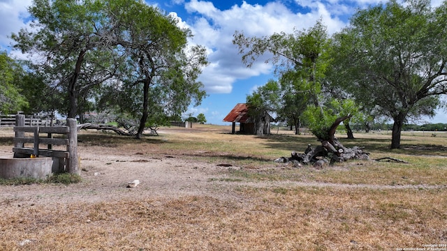 view of yard with a rural view