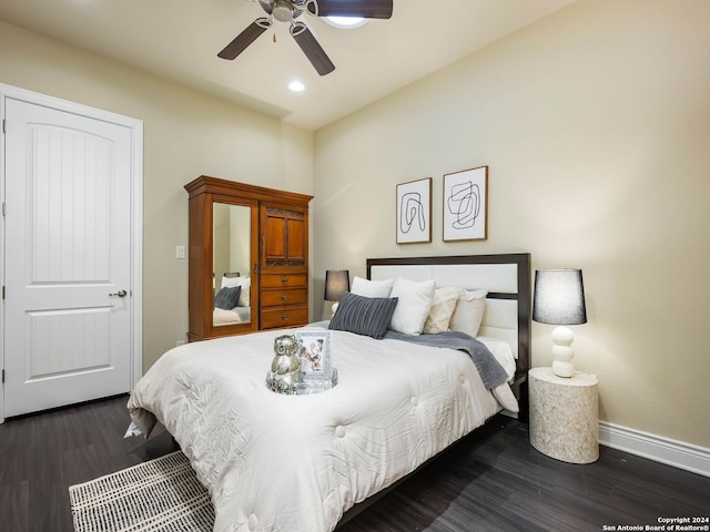 bedroom featuring ceiling fan and dark hardwood / wood-style floors