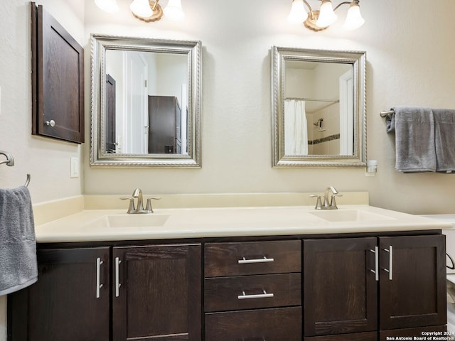 bathroom with vanity and a shower with shower curtain