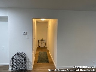 hallway featuring hardwood / wood-style flooring