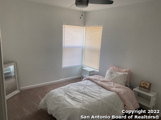 bedroom with ceiling fan and carpet