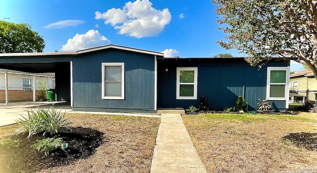 view of front of property with a carport