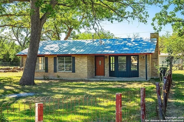 ranch-style house with a front yard